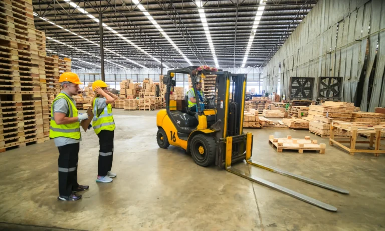Forklift lifting palletised cargo for HS Agency warehousing and logistics