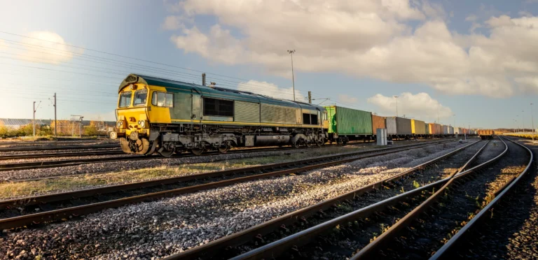 Rail freight train entering a terminal as part of HS Agency transport logistics