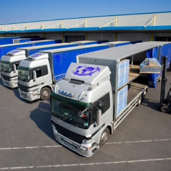 Logistics trucks parked at HS Agency's facility, showcasing efficient transportation and warehousing solutions for seamless supply chain management in the UK and Ireland.