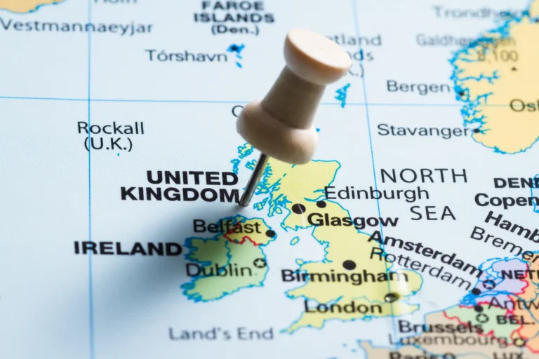 Map highlighting the United Kingdom and Ireland with a pushpin marking Belfast, representing HS Agency's logistical solutions for seamless transportation and warehousing services across the U.K. and Ireland.